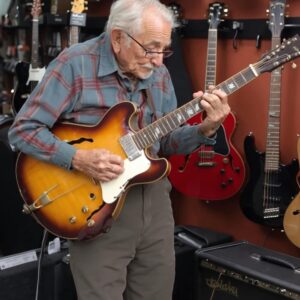 An 81-year-old grandpa walks into a guitar store, picks up one of the guitars, and starts playing to everyone’s amazement.