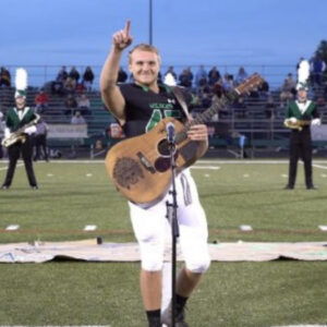 No One Was Willing To Sing The National Anthem, So One High Schooler Took Off His Helmet And Grabbed A Guitar(video)