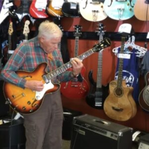 An 81-year-old grandpa walks into a guitar store, picks up one of the guitars, and starts playing to everyone’s amazement.