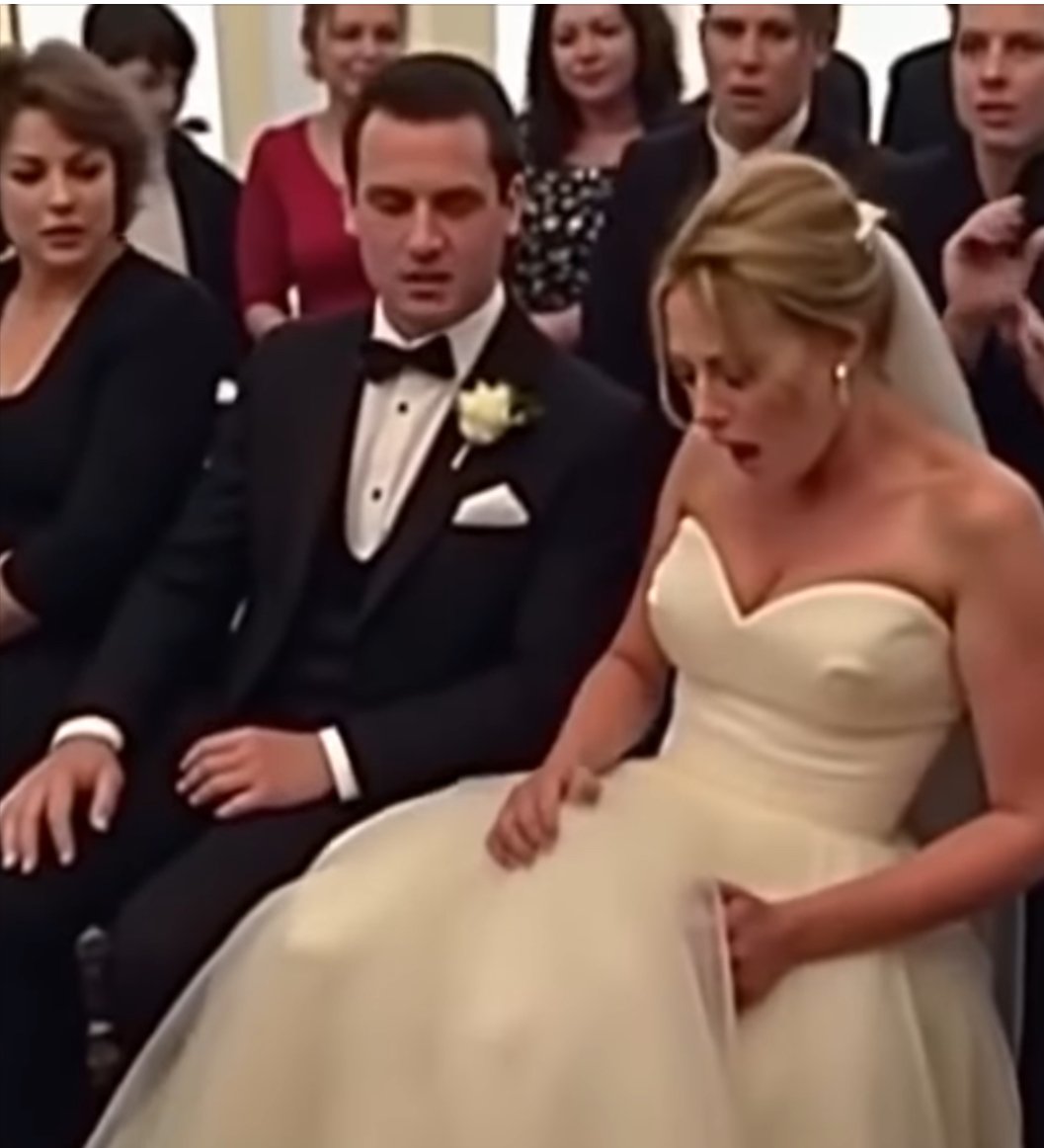 During the wedding, something stirred beneath the bride’s dress! The groom went pale